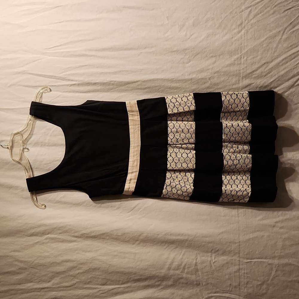 Black dress with white lace stripes
